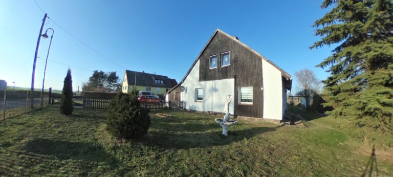 Außenansicht des Neubau-Einfamilienhauses im Rohbauzustand in Baumgarten (18246, Landkreis Rostock, Wiesenweg) mit großem Grundstück – Referenzobjekt 5679 – Büchel Immobilien Rostock